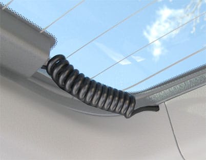 Coil cord for defroster on hatchback flip up glass